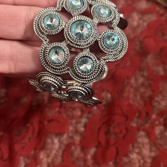 Two bracelets. One is stretch, Blue and silver and one has a clasp, tan and gold - Picture 7 of 7